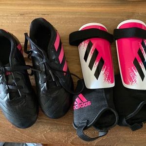 Set of shin guards and soccer cleats